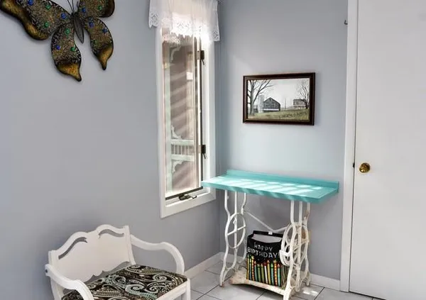 a roof deck with table and chairs