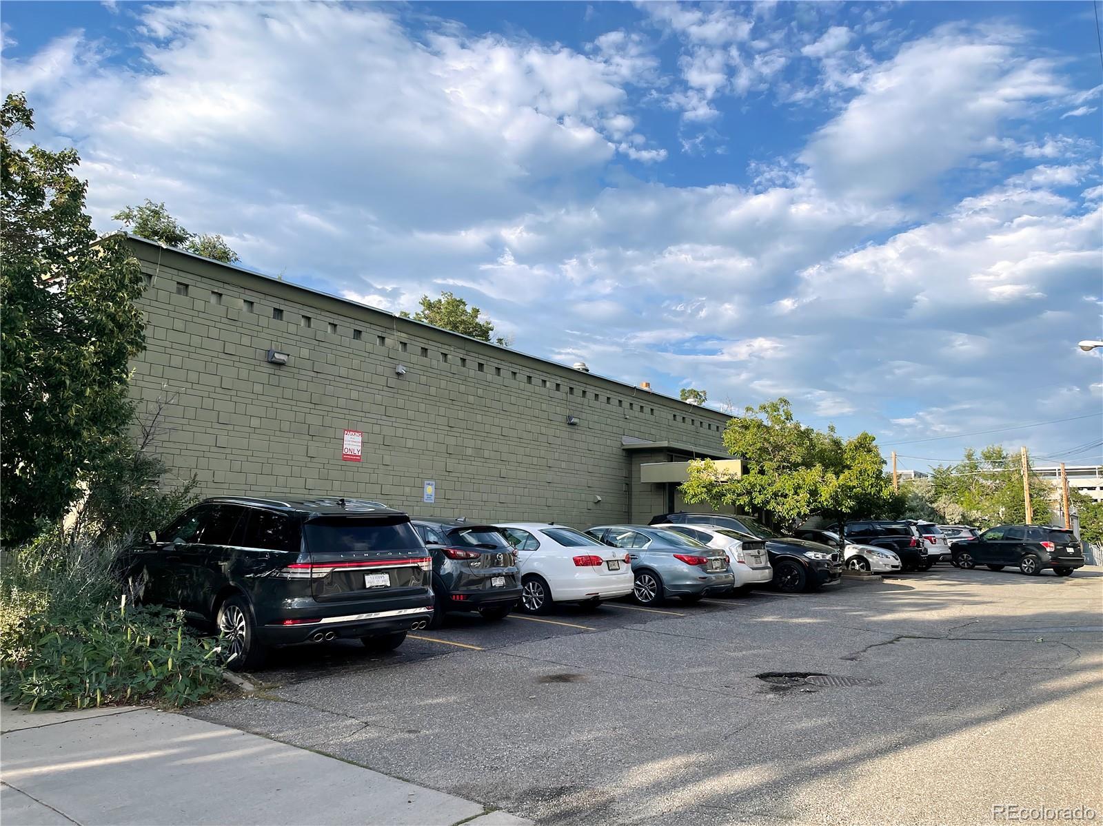 536-520 Cherokee Street Denver, CO 80204 - Photo 13 of 37 a front view of a house with cars parked