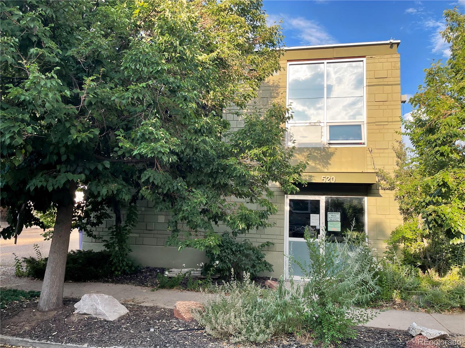 536-520 Cherokee Street Denver, CO 80204 - Photo 14 of 37 a front view of a house with a yard