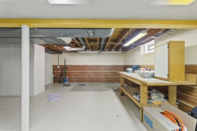 a white toilet sitting next to a bathroom sink and a shower