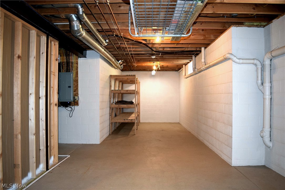 17000 Wing Road Chagrin Falls, OH 44023 - Photo 25 of 35 Large basement storage/workshop area off the Rec Room. Note the 13 course block height of the entire basement!