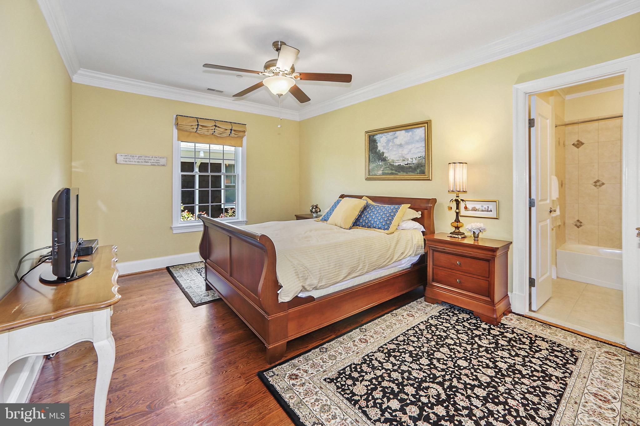 7117 Exfair Road Bethesda, MD 20814 - Photo 23 of 42 a bedroom with a bed and wooden floor