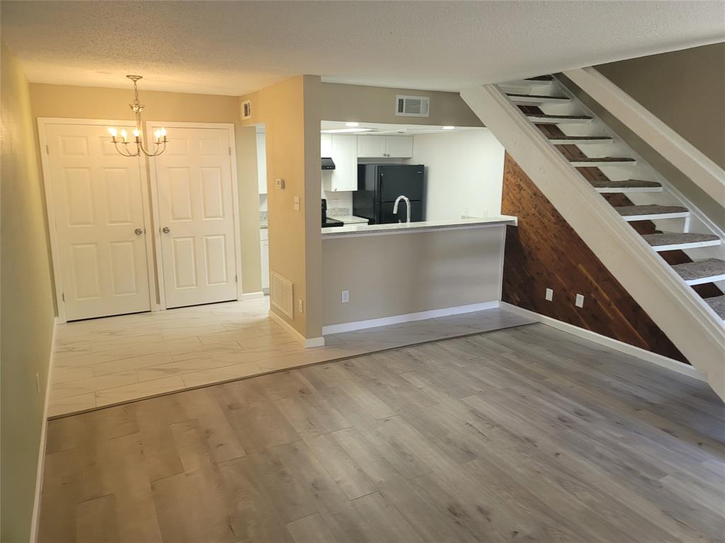 a view of a kitchen with a sink cabinets and window