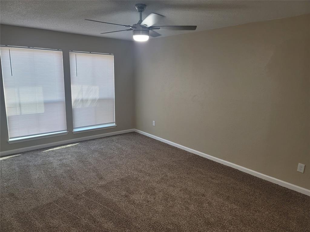 4616 Country Creek Drive, Unit 1176 Dallas, TX 75236 - Photo 12 of 19 an empty room with a empty space and windows