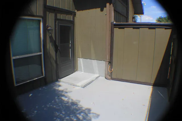 a bathroom with a shower and a sink