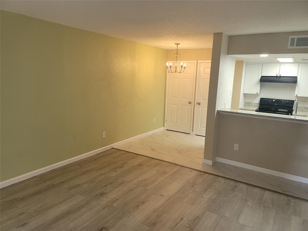 4616 Country Creek Drive, Unit 1176 Dallas, TX 75236 - Photo 5 of 19 wooden floor in an empty room