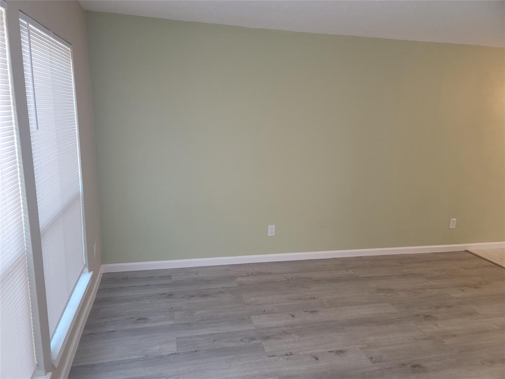 4616 Country Creek Drive, Unit 1176 Dallas, TX 75236 - Photo 6 of 19 a view of an empty room and wooden floor