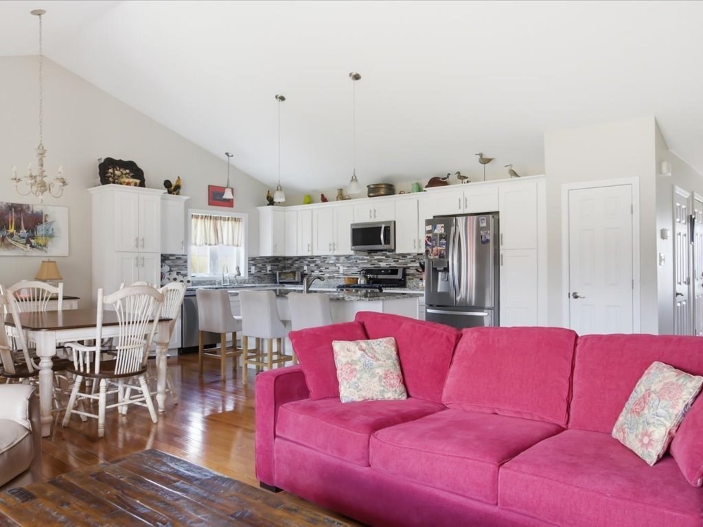 67 Ling Street Fall River, MA 02720 - Photo 10 of 32 a living room with furniture kitchen view and a wooden floor