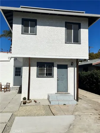 a front view of a house with garage