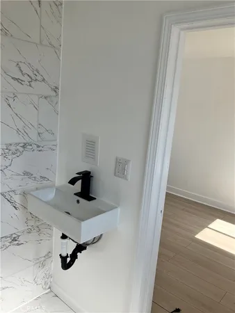 a kitchen with a sink and an oven