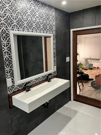 a bathroom with a sink and a mirror