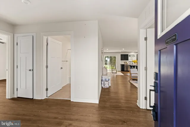 a living room with furniture a rug and a window