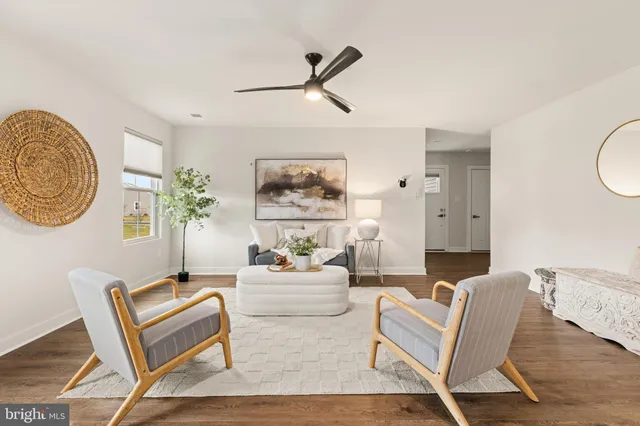 a large kitchen with stainless steel appliances granite countertop a refrigerator and a stove top oven