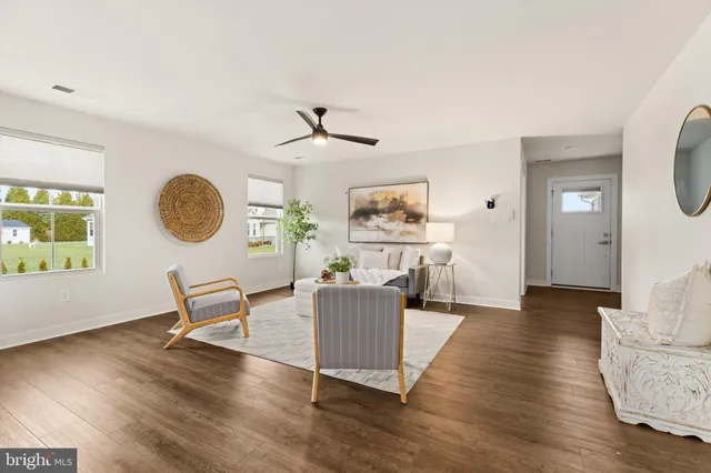 a kitchen with granite countertop a sink a stove and wooden cabinets