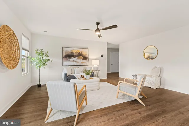 a kitchen with kitchen island granite countertop a sink a stove counter space and cabinets