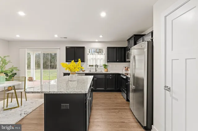 a view of a hallway with furniture