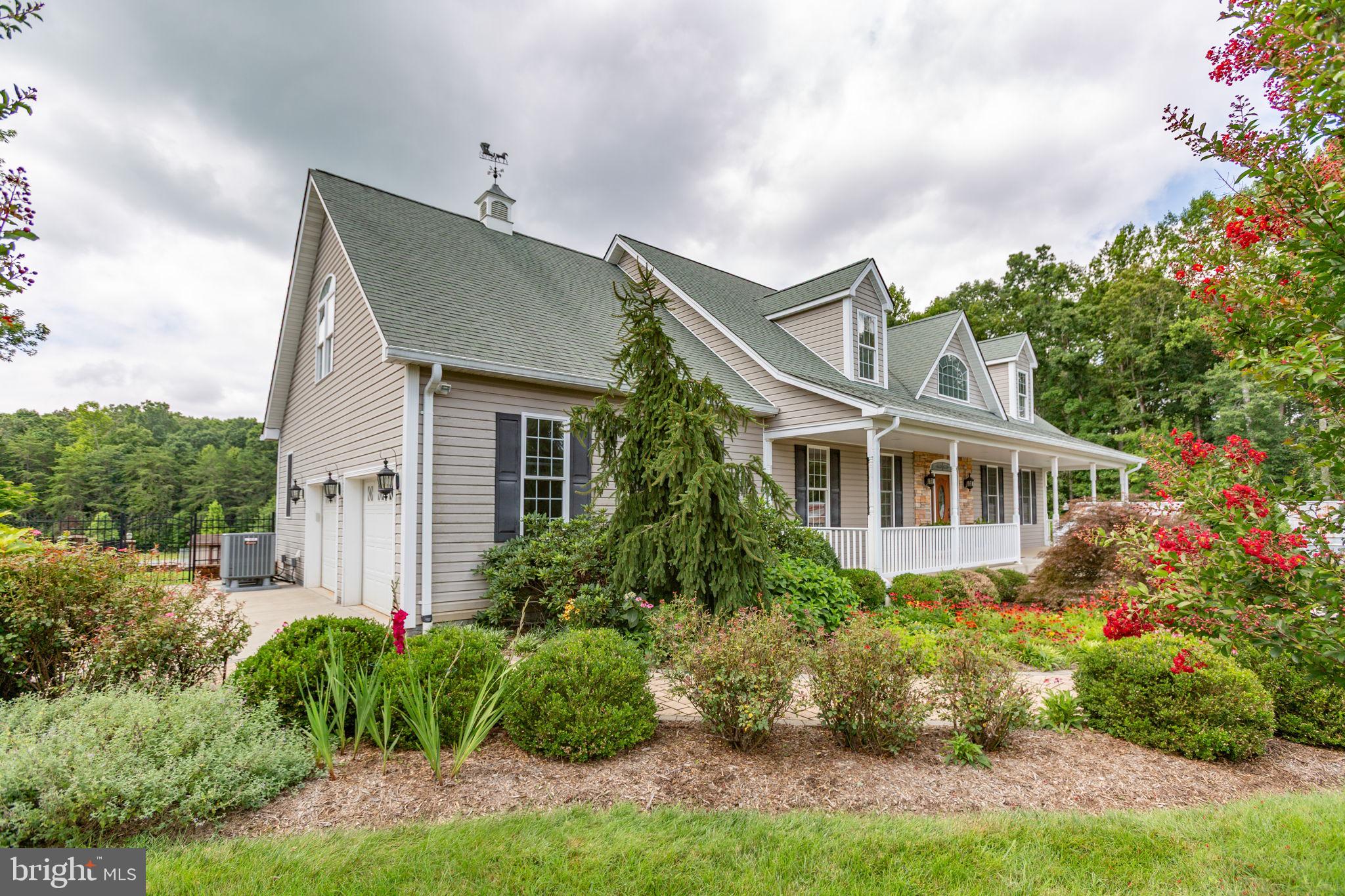 31260 Eleys Ford Road Fredericksburg, VA 22407 - Photo 2 of 108 a front view of a house with garden