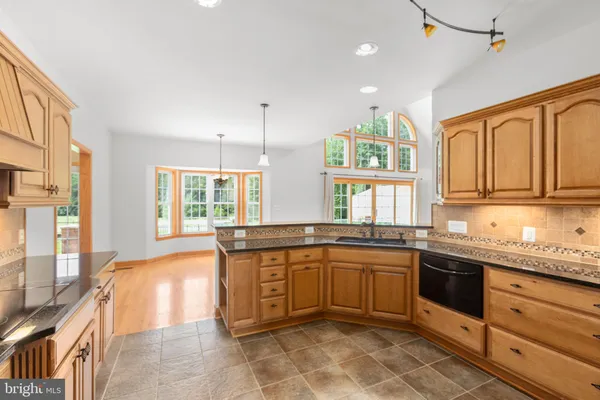 a bath tub sitting in a bathroom next to a window