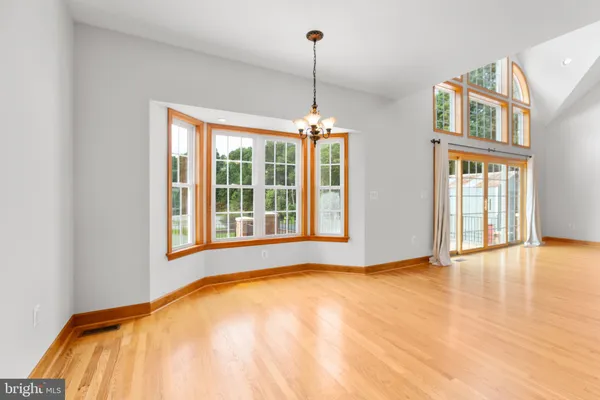 a living room with a window and a table