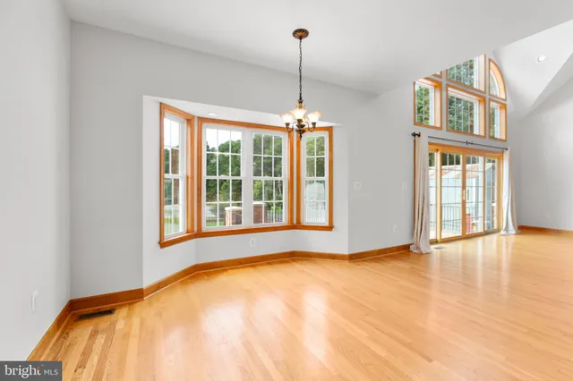 a living room with a window and a table