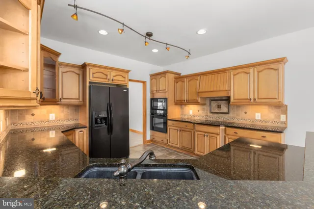 an empty room with closet and a bathroom