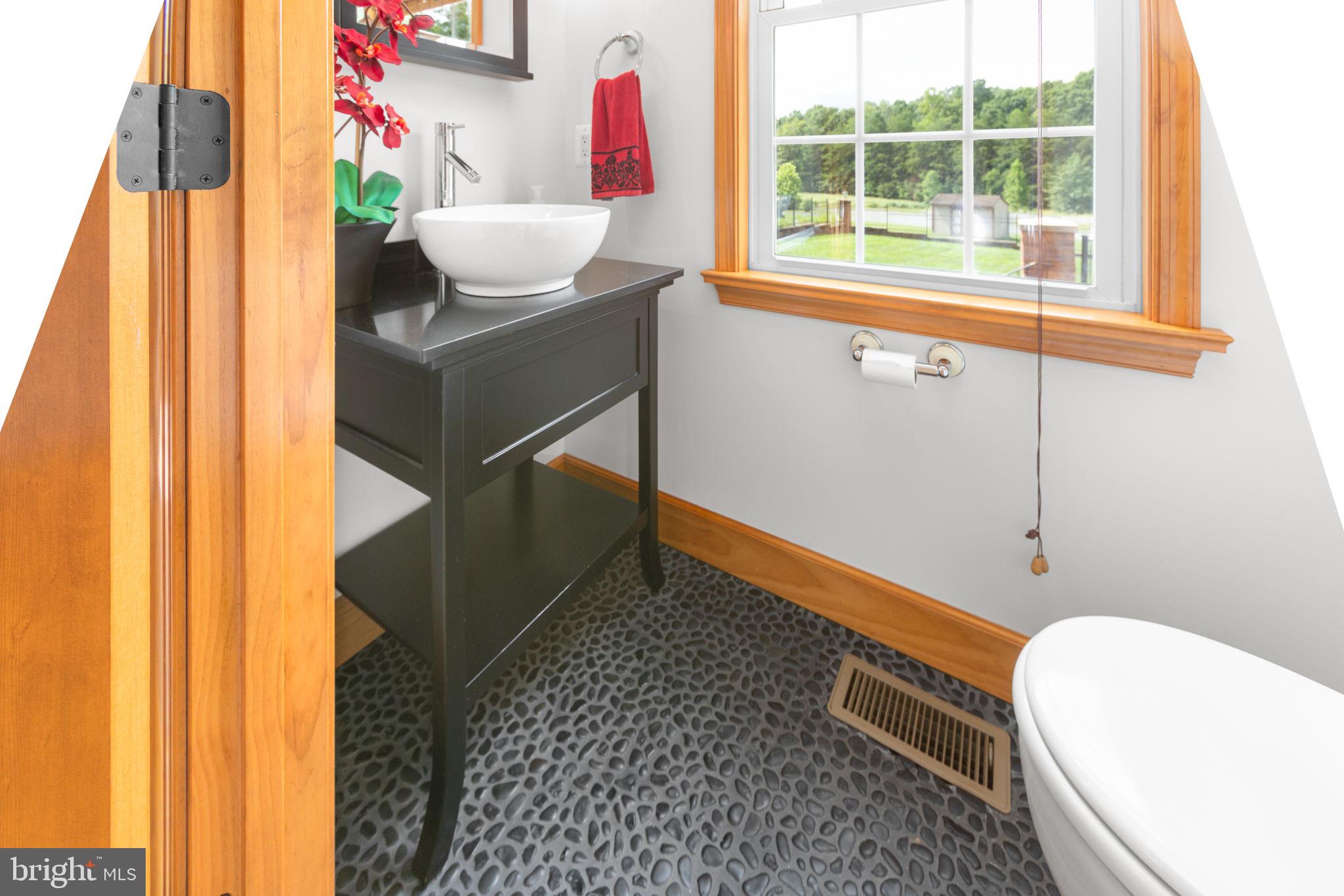 31260 Eleys Ford Road Fredericksburg, VA 22407 - Photo 40 of 108 a living room with a window and a table