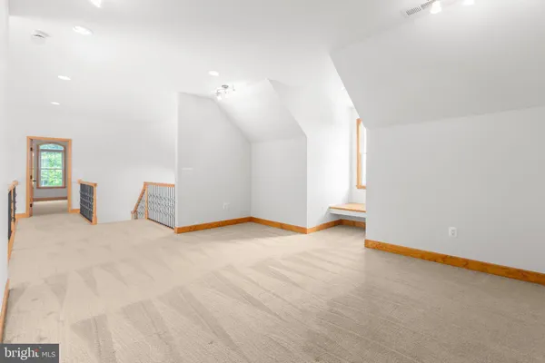 a view of a house with a big yard next to a yard