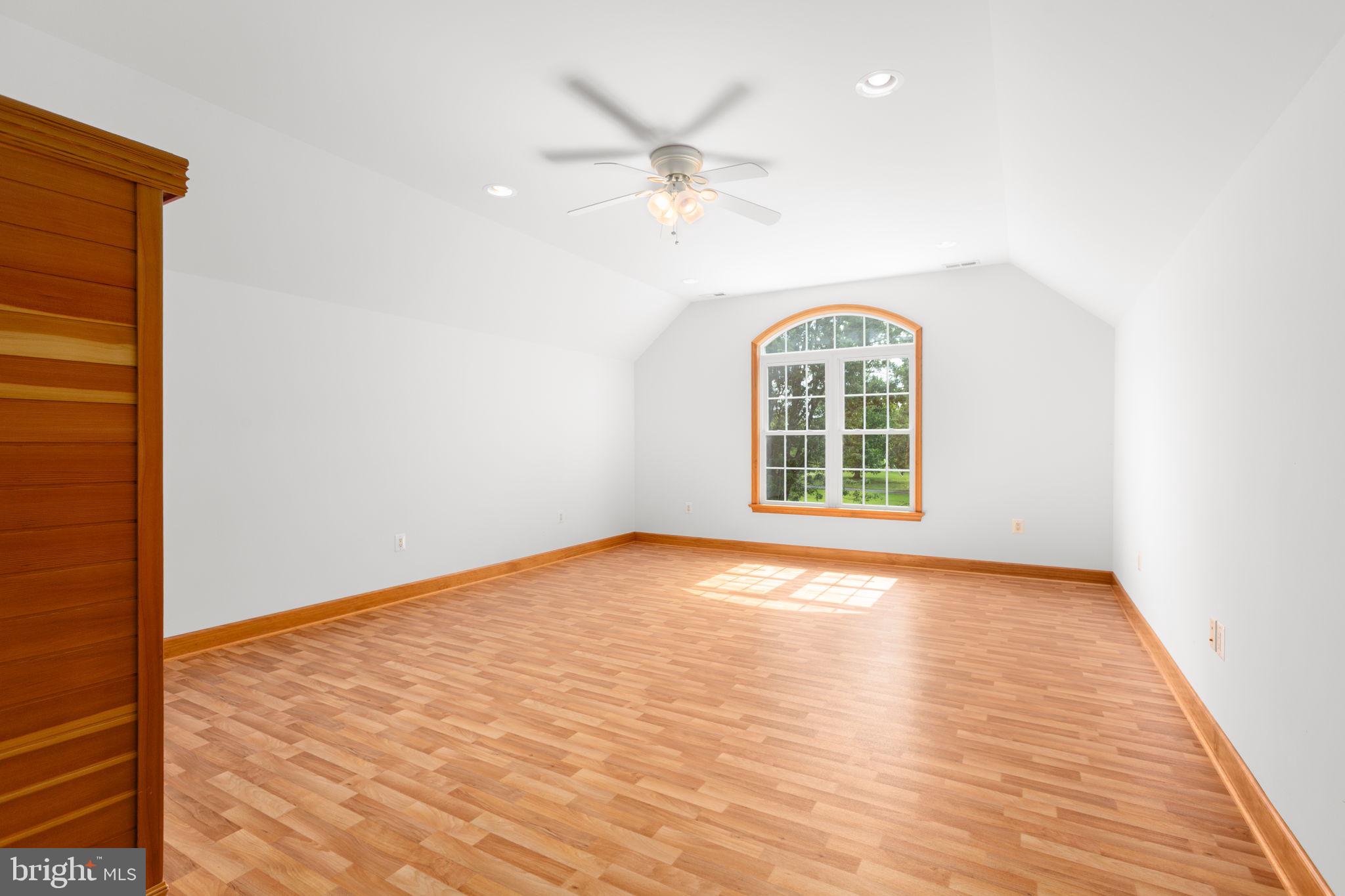 31260 Eleys Ford Road Fredericksburg, VA 22407 - Photo 48 of 108 a view of an empty room with a window and wooden floor