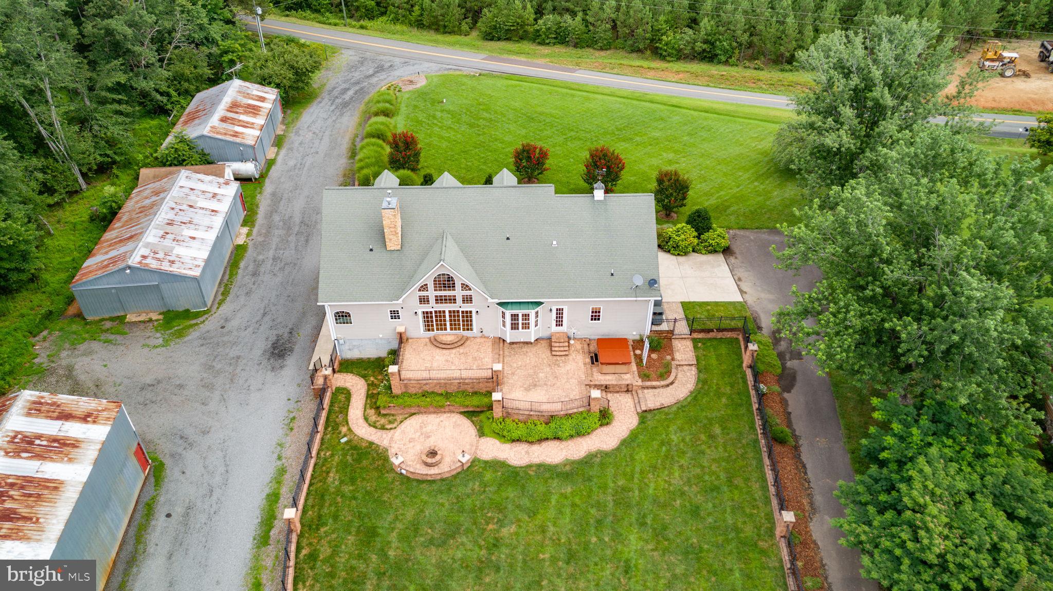 31260 Eleys Ford Road Fredericksburg, VA 22407 - Photo 9 of 108 an aerial view of a house with outdoor space patio and trees all around