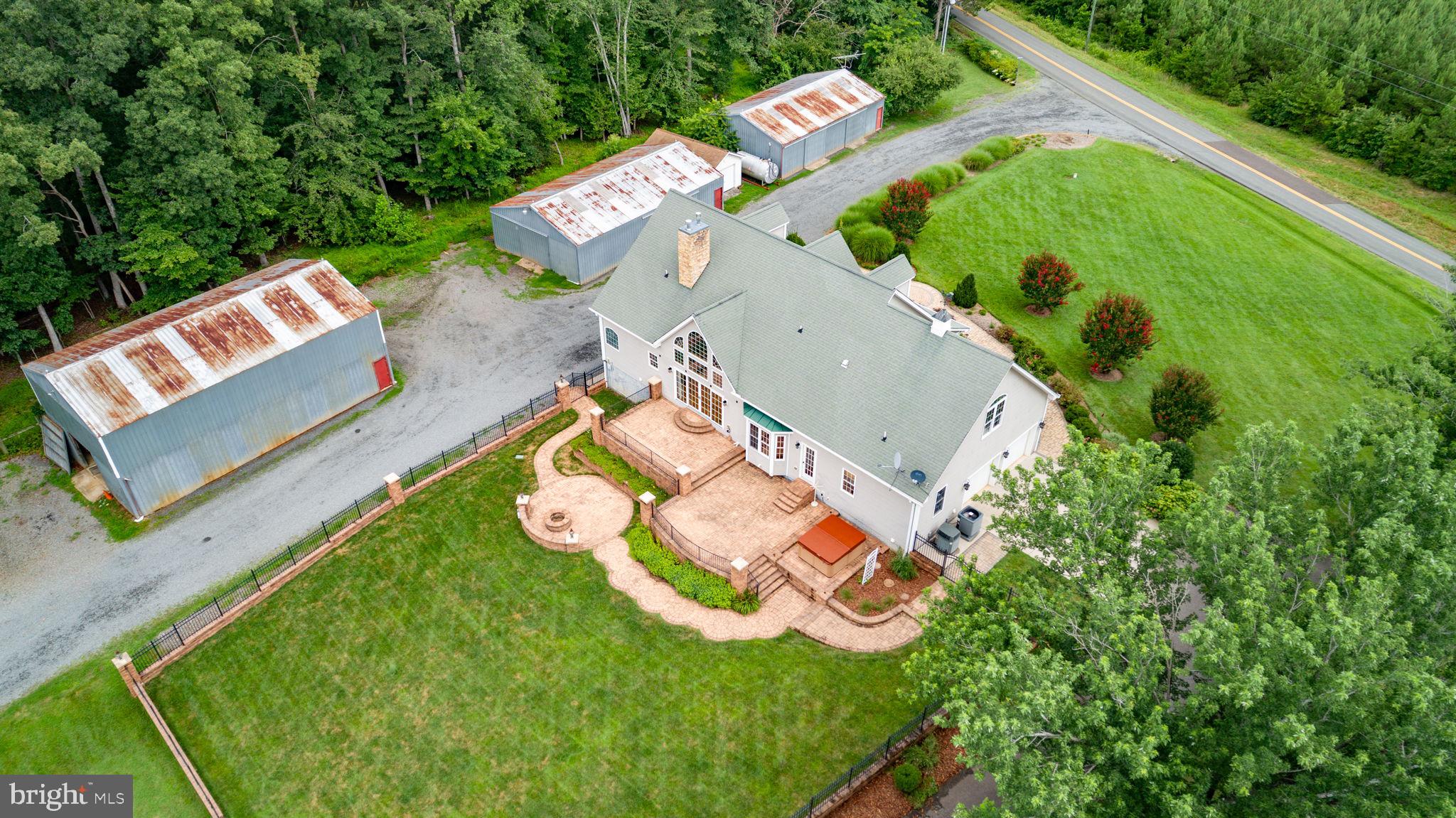 31260 Eleys Ford Road Fredericksburg, VA 22407 - Photo 10 of 108 an aerial view of a house with a garden and swimming pool