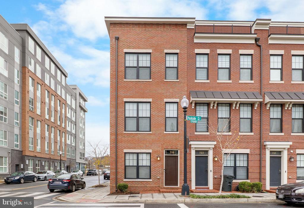 a front view of a building with a street