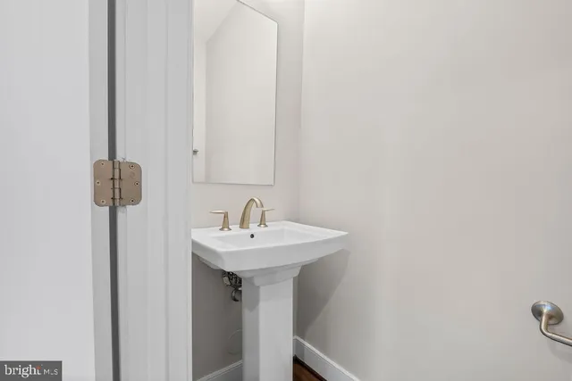 a bathroom with a sink and mirror