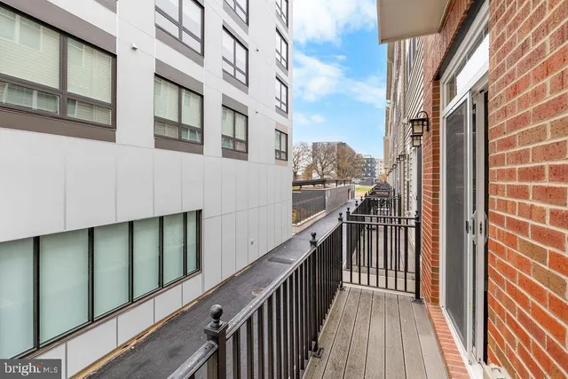 a view of a balcony with wooden floor and stairs