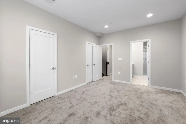 a bathroom with a shower a toilet and sink