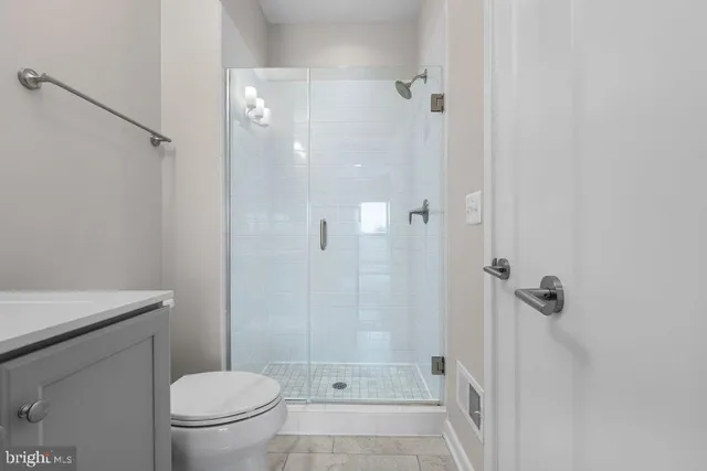 an empty room with a empty space and windows