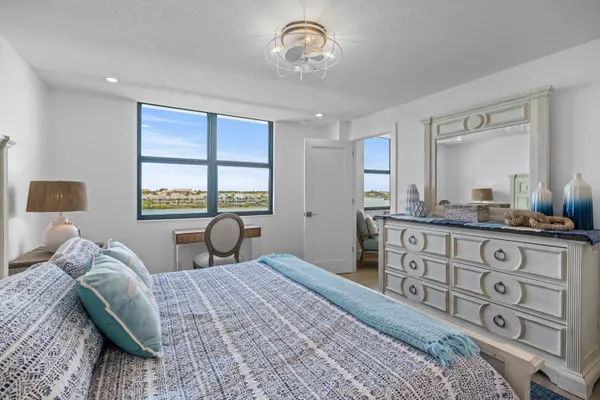 a bedroom with a large bed and a window