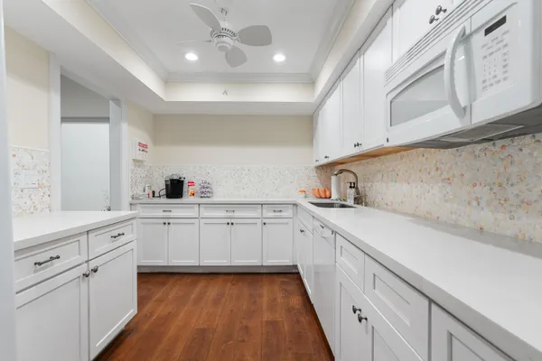 an outdoor view of house with swimming pool and green space