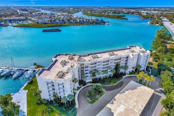 a view of a lake with a table and chairs