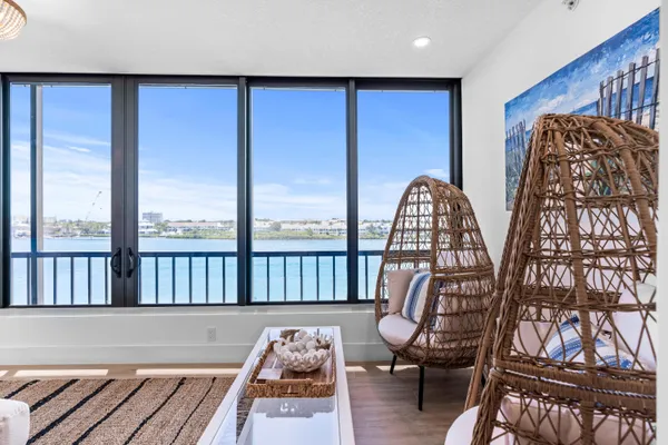 a view of living room with furniture and wooden floor