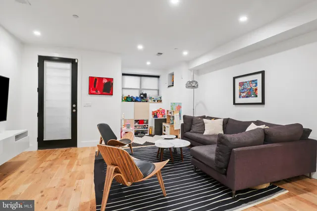 a workspace with furniture and wooden floor