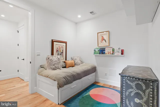 a bathroom with a sink a toilet and shower curtain