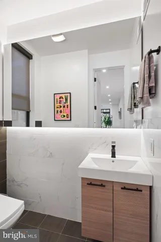 a bedroom with a bed and glass window