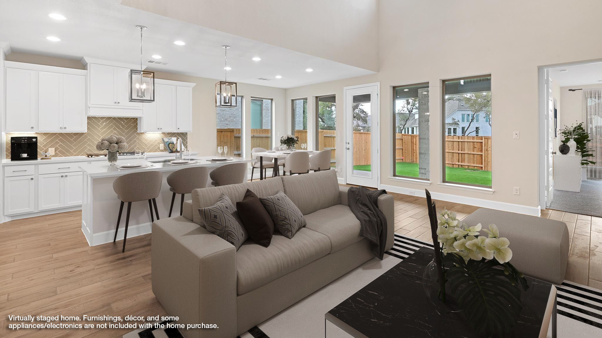 338 Prickly Poppy Loop Kyle, TX 78640 - Photo 5 of 40 Living room featuring light wood-style floors, recessed lighting, and a high ceiling