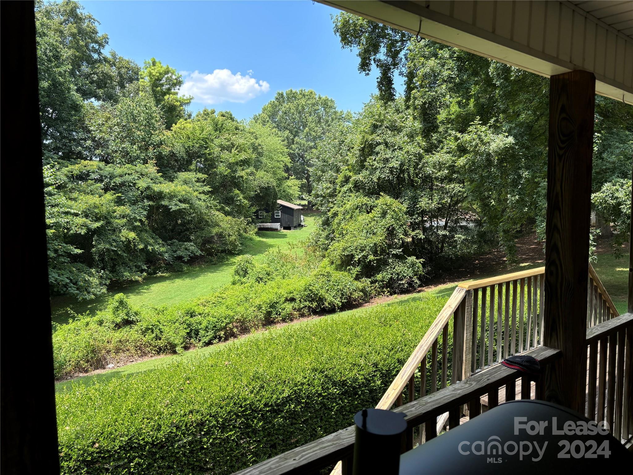 276 Isle Of Pines Road, Unit B Mooresville, NC 28117 - Photo 2 of 8 a view of a wooden deck with a yard