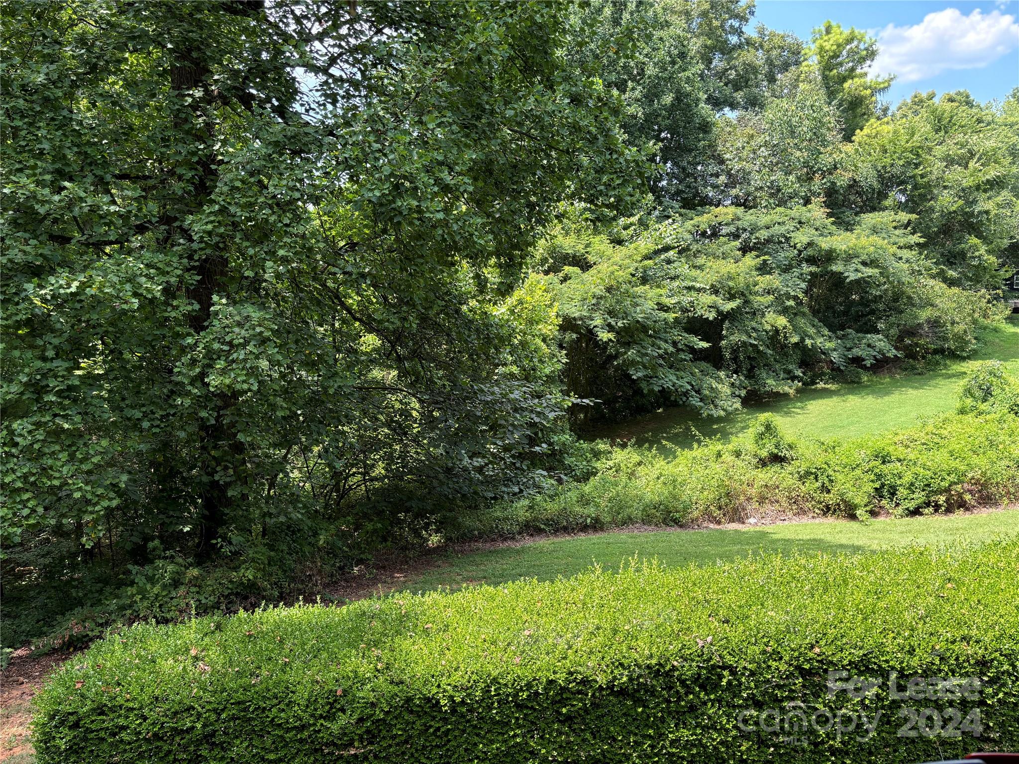 276 Isle Of Pines Road, Unit B Mooresville, NC 28117 - Photo 3 of 8 a view of a garden