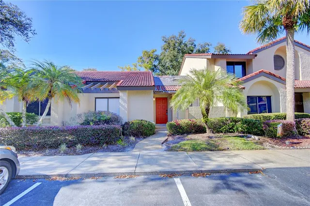 a front view of a house with yard and outdoor