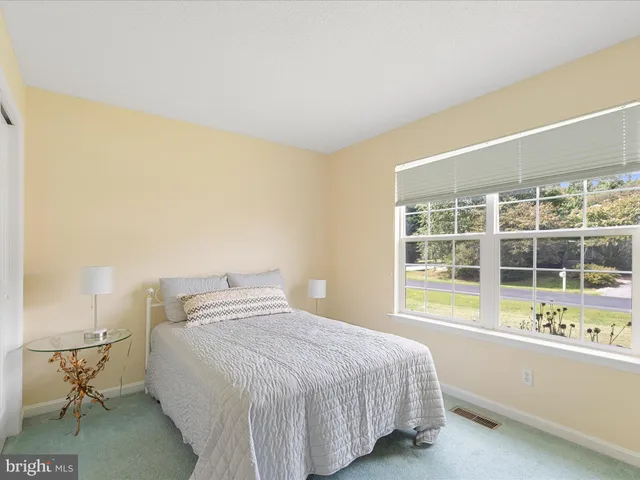 a room with a bed and a window