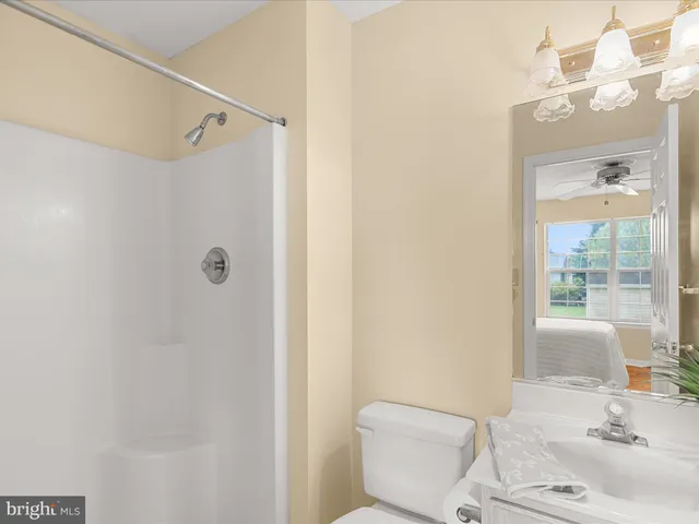 a view of a deck with furniture and garden