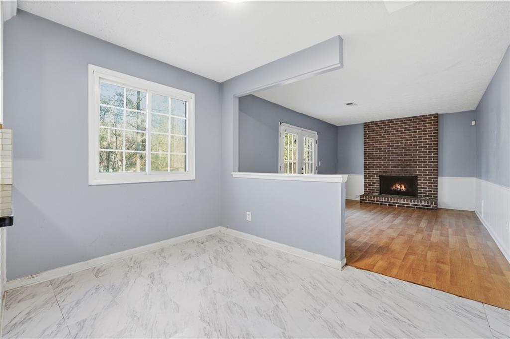4828 Oak Path Stone Mountain, GA 30088 - Photo 15 of 40 a view of a livingroom with a fireplace and window