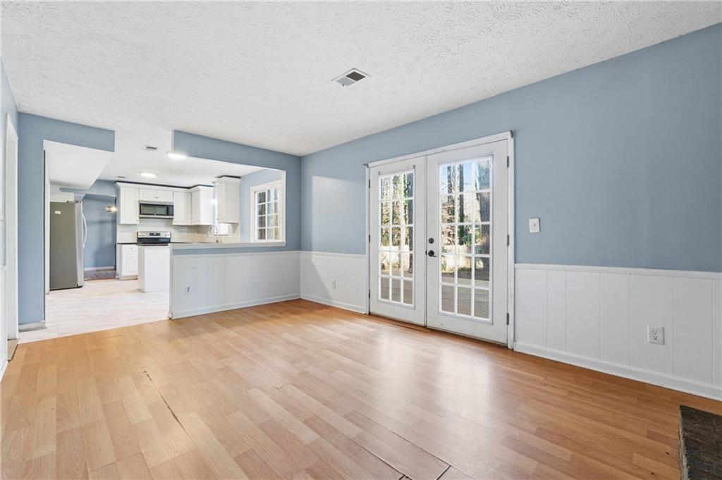 4828 Oak Path Stone Mountain, GA 30088 - Photo 18 of 40 a view of a kitchen with furniture and wooden floor